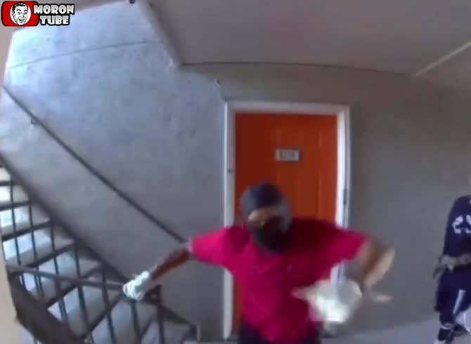 Video :After two robbers attempt to break through a door, they are greeted by
